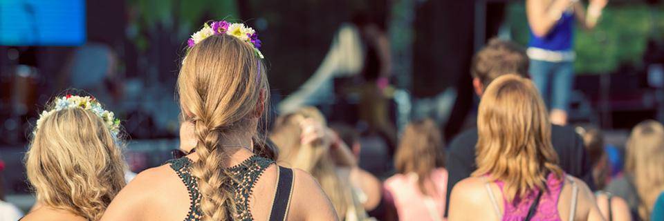 Girls watching a live performance at the fete de la musique in France