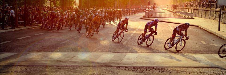 Tour de France cyclists in the sunset