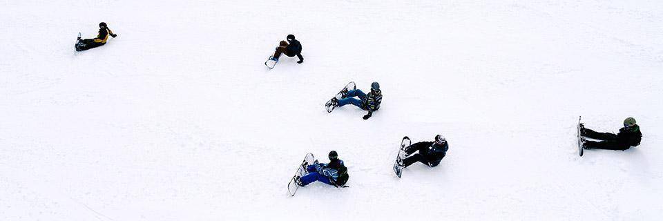 People learn to snowboard in the Alps